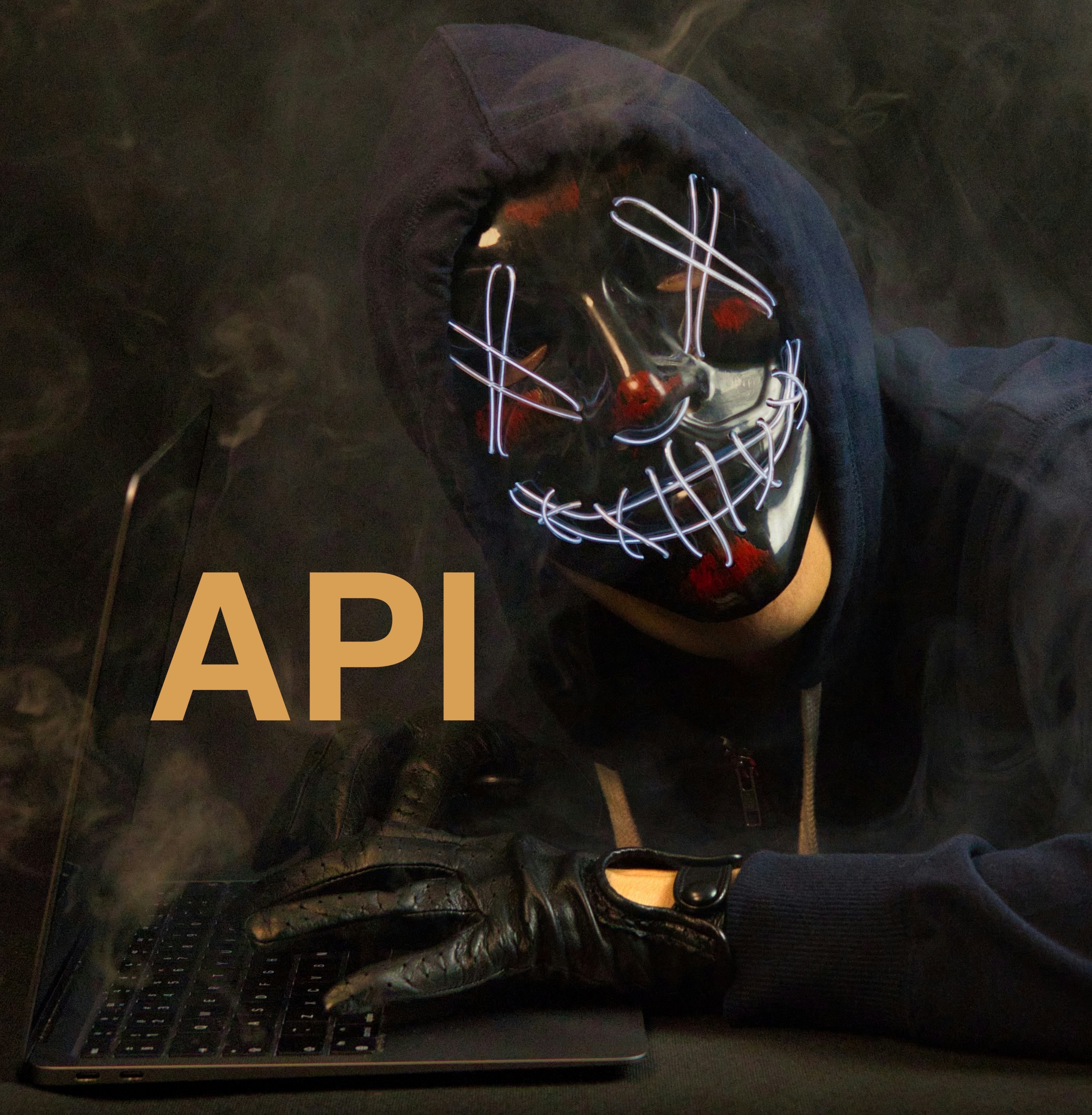 cyber attacker person with laptop and API text